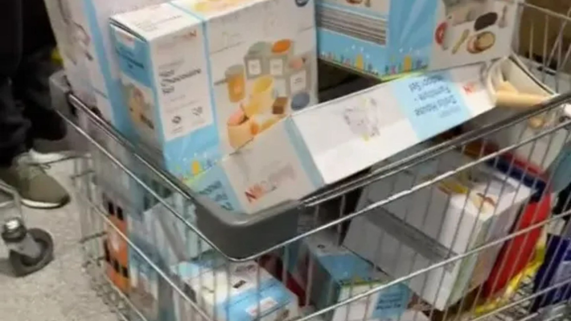 Watch as bargain-crazed Aldi shoppers load their shopping carts with wooden toys