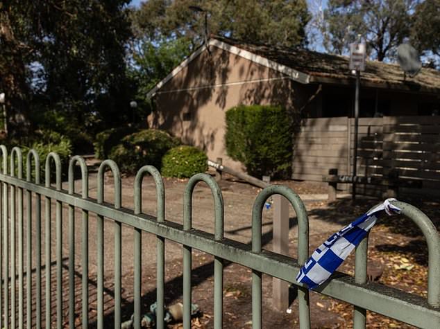 Young woman arrested after man is found dead in a house in Mitcham, Melbourne and a paramedic is allegedly attacked