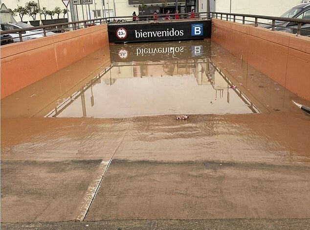 Spain’s ‘mass grave’ underground car parks give up their terrible secrets: As flood water is pumped out, rescuers  fears disaster’s true death toll is being downplayed and they are counting bodies ‘by the hundred’ – as floods spread to new holiday hotspots