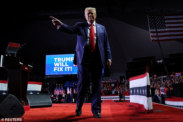 Trump delivers a vicious insult to his greatest enemy as he extends his LAST campaign rally in Michigan past 2 a.m. after racking up more than 900 victories