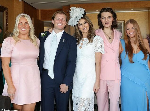 Elizabeth Hurley tenderly puts her arm around ex Shane Warne’s daughter Brooke as she reunites with the late cricketer’s children on Crown Oaks Day in Melbourne