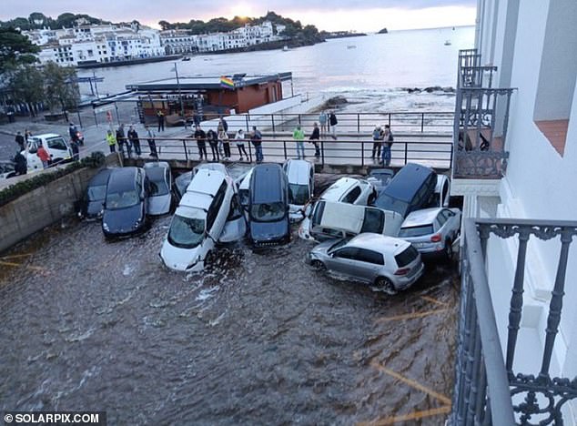 Spain hit by new flash floods: Freak deluge leaves cars floating through the streets of Girona, just over a week after 200 people died in Valencia disaster