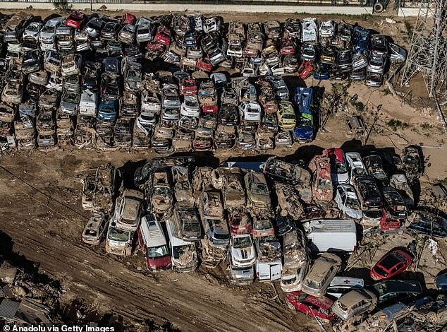 Valencia Junkyard: Dramatic photos show row after row of mangled cars after being swept away by deadly Spanish floods