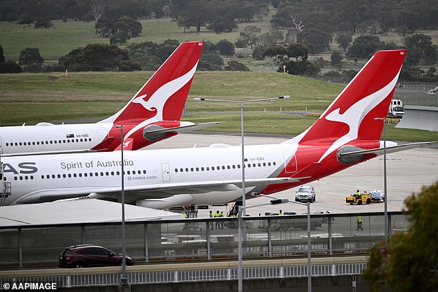 Qantas flight from hell: Woman and child rushed to hospital after being injured by turbulence