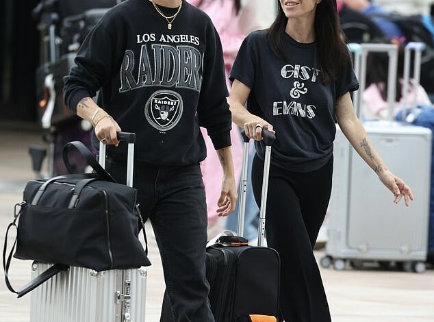 Veronicas singer Jess Origliasso shares a sweet hug with fiance Alex Smith at Sydney airport as the couple arrives in Australia