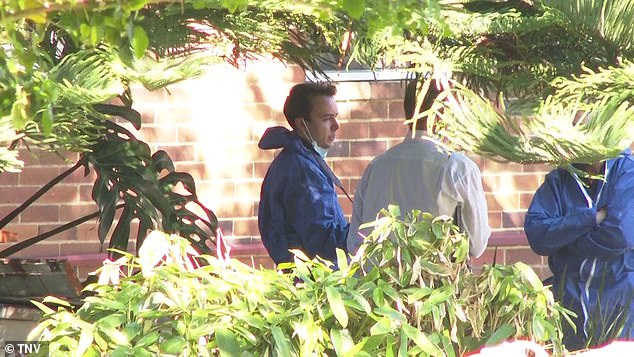 Man taken to police station after woman’s body is found in beachside suburban unit