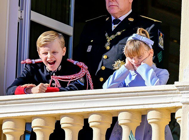 Prince Jacques and Princess Gabriella of Monaco, nine, rival Charlotte and Louis with their naughty antics on palace balcony during National Day