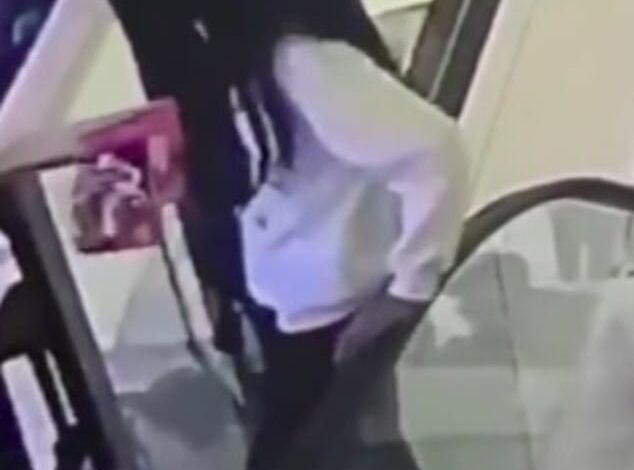 Horrifying moment when a woman falls four floors to her death in a shopping center after sitting on a moving escalator handrail