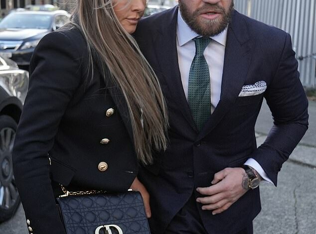 Conor McGregor arrives at court with his partner Dee Devlin and his parents as a considered verdict from the jury in a rape hearing