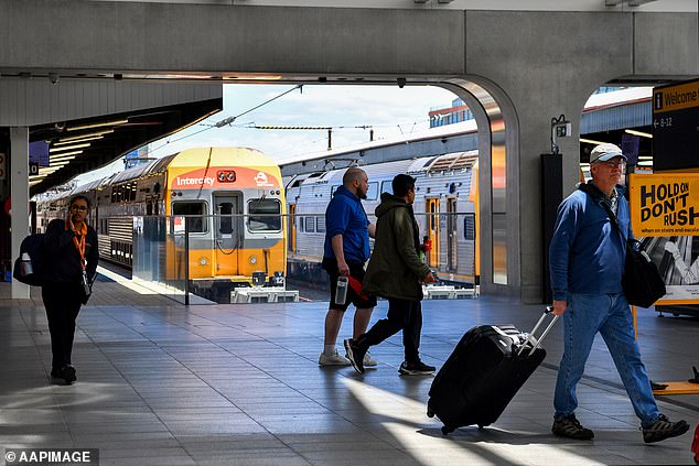 Woman airlifted to hospital after being stabbed in the chest on a crowded Sydney train as alleged knifeman was tasered by police