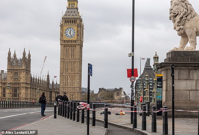 Police flood Westminster Bridge after man is stabbed in front of shocked tourists yards from the Houses of Parliament – ​​as officers arrest four people after ‘attempted murder’