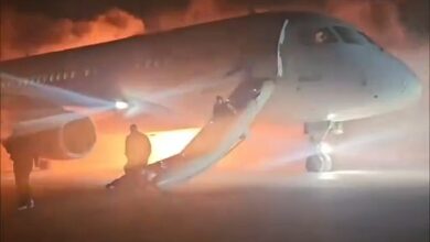 Terrifying moment as families with young children flee from emergency slides as holiday plane catches fire after landing at Turkey’s Antalya airport