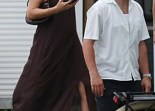 Pregnant Steph Claire Smith shows off her baby bump in a strapless dress as she and husband Josh Miller attend the wedding of a popular radio star in Queensland