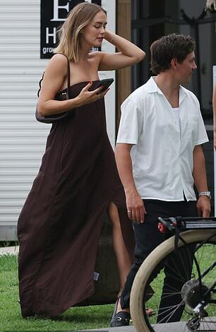 Pregnant Steph Claire Smith shows off her baby bump in a strapless dress as she and husband Josh Miller attend the wedding of a popular radio star in Queensland