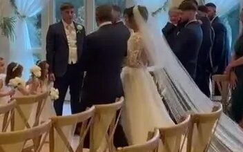 The moment proud father-of-22 Noel Radford gives away daughter Millie at the wedding