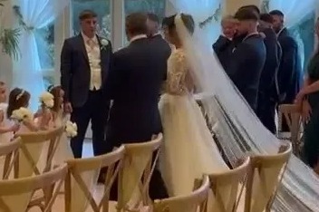 The moment proud father-of-22 Noel Radford gives away daughter Millie at the wedding