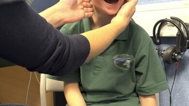 Watch the joyful moment when a boy born deaf in one ear receives a new hearing aid