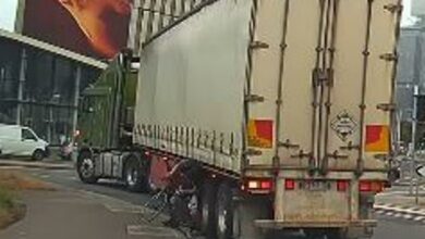 Cyclist narrowly escapes being dragged under a truck after his bike wheels are crushed – but who’s to blame?