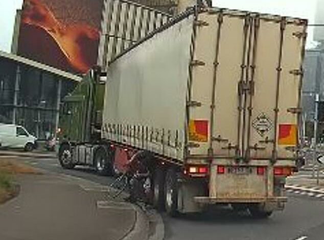 Cyclist narrowly escapes being dragged under a truck after his bike wheels are crushed – but who’s to blame?